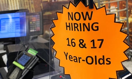 Signage advertising hiring for 16- and 17-year-olds is displayed on a cash register inside a store in Las Vegas, Nevada.