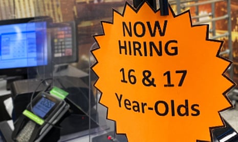 Signage advertising hiring for 16- and 17-year-olds is displayed on a cash register inside a store in Las Vegas, Nevada.