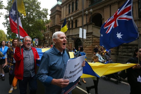 Ukrainians in Sydney and their supporters march towards St. Mary's Cathedral Square during the '365 Days Strong' rally and candlelight vigil on February 23, 2023 in Sydney, Australia.