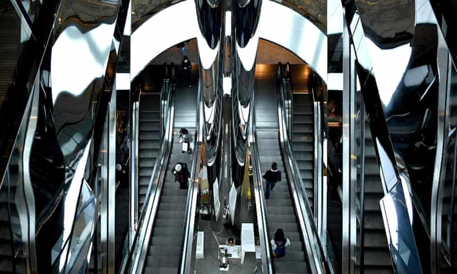  Shoppers on an escalator at a shopping centre in Sydney 