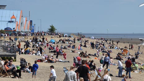 Brits flock to beaches as coronavirus lockdown eases – video