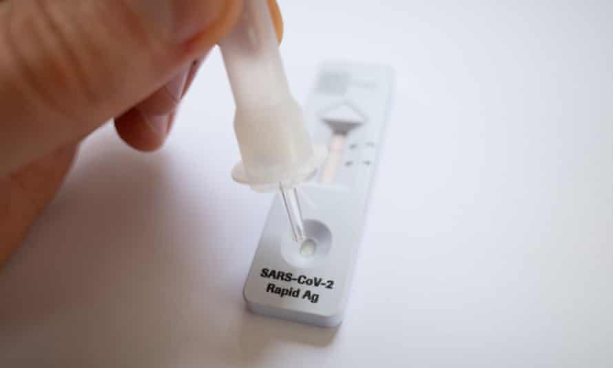 A generic image of a person using a SARS CoV-2 Rapid Antigen Test