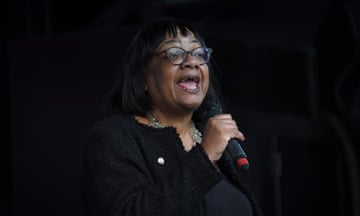 Diane Abbott speaking into a microphone at an event.