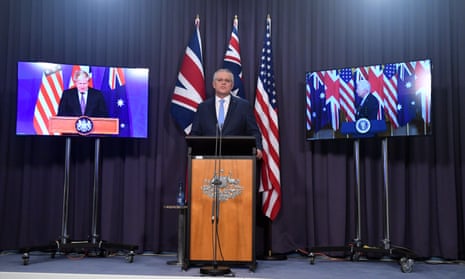 Australia's prime minister, Scott Morrison, is flanked onscreen by Boris Johnson and Joe Biden for the Aukus announcement