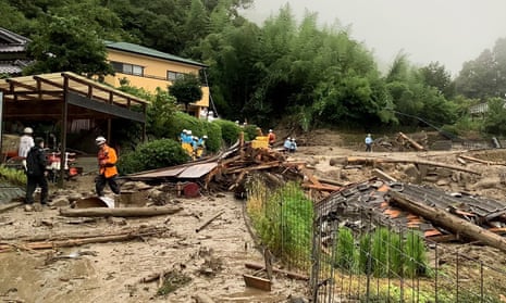 Rescuers working on a landslide triggered by heavy rain in Kanzaki, Saga prefecture, south-western Japan.