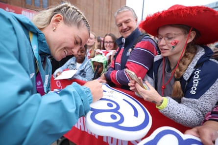 Claudia Moloney-MacDonald signs memorabilia for England fans.