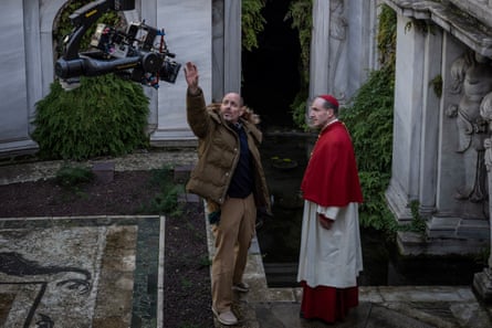 Director Edward Berger and Ralph Fiennes on the set of Conclave.