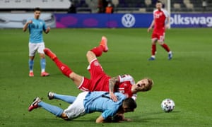 Israel’s Hatem Elhamed in action with Denmark’s Daniel Wass.