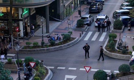 Police officers cordon off the area where Alejandro Vidal-Quadras was shot in Madrid.