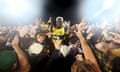 Central Coast Mariners player Alou Kuol is hoisted aloft by fans at full-time of the A-League Men grand final