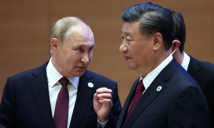 Russian president Vladimir Putin speaks with Chinese president Xi Jinping in Samarkand, Uzbekistan.