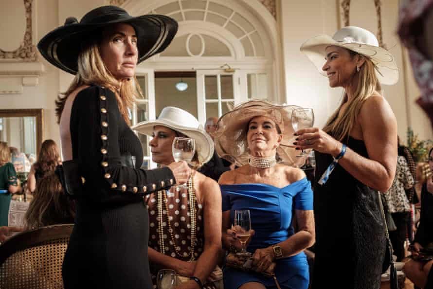 Exclusive members of the Jockey Club hippodrome, including 70-year-old Teresa Aczel Quattrone, wait at the Salao das Rosas, for the Grande Premio Brasil, the country’s biggest horse race of the year, in Rio de Janeiro, on 11 June