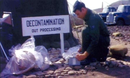 A US soldier looks through the material found after the Palomares crash