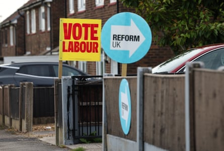 Signs for Labour and Reform UK outside neighbouring homes in Makerfield.
