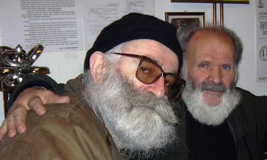 Karadžić (left), while living as Dragan Dabic.