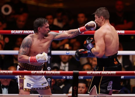Oleksandr Usyk (left) connects with Rico Verhoeven during the fight