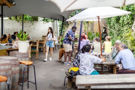 Adults sat out in a beer garden