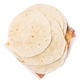 A pile of uncooked tortillas.