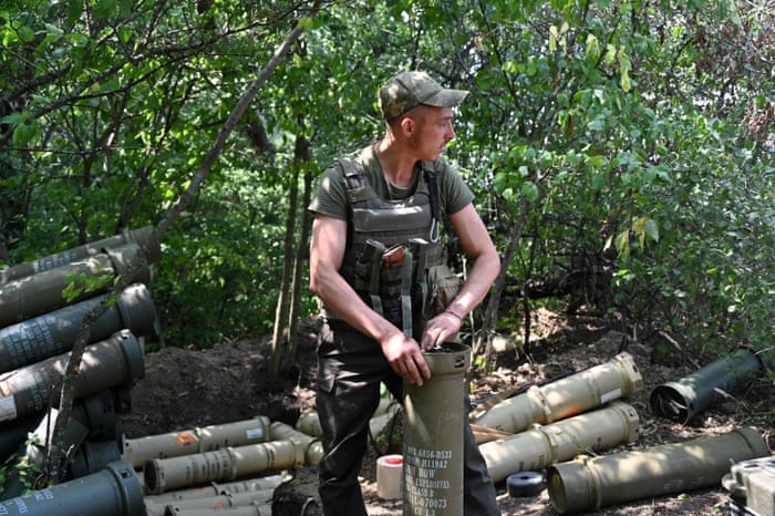 A Ukrainian gunmen prepares charges on the front line in the Kharkiv region.