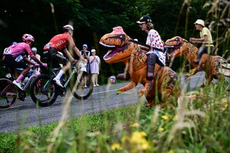 A couple of Tyrannosaurus Rex dinosaurs encourage yesterday’s breakaway from the roadside.