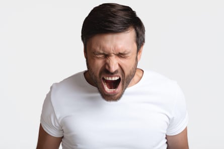A man shouting with rage
