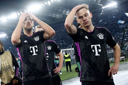 Harry Kane and Joshua Kimmich look dejected at the end of the match