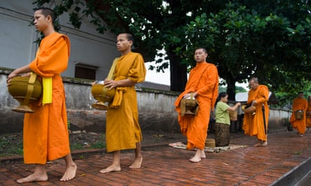 Buddhist monks collecting alms early in the morning.