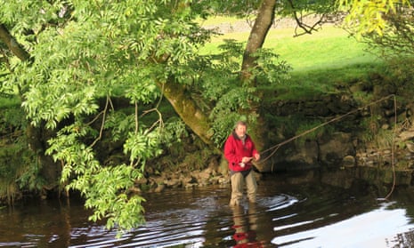 An angler in the river at Horton-in-Ribblesdale