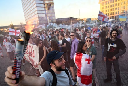Demonstrators against the ‘foreign influence’ law gather for a concert aimed at raising funds to pay police fines of their fellow protesters, in Tbilisi’s Republic Square in June.