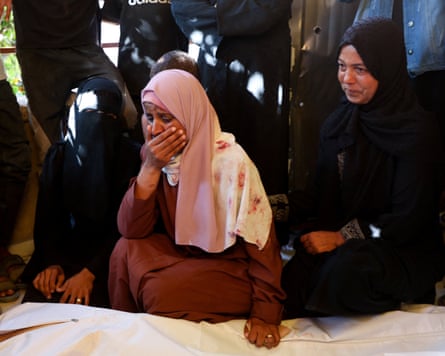 Mourners attend the funeral of Palestinians who were killed while trying to receive aid on Saturday.