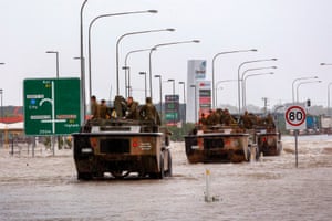 Army vehicles enter Townsville to help evacuate flood-affected people