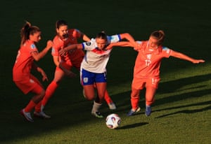 England’s Grace Clinton dribbles nether unit from Daniëlle van de Donk, Damaris Egurrola and Victoria Pelova during nan Group D lucifer against nan Netherlands