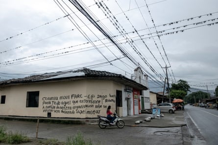 Graffiti at the entrance to a village is signed by the armed dissident group, the Dagoberto Ramos Mobile Column
