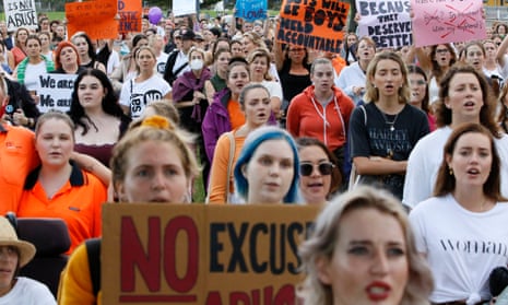 Protesters are seen during a rally against gendered violence and domestic violence towards women in Newcastle in 2022.