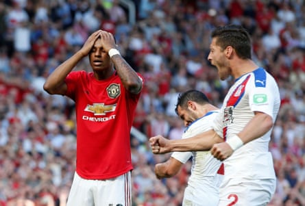 Palace players react after Marcus Rashford’s penalty miss.
