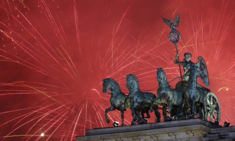 Fireworks light the sky above the Brandenburg Gate shortly after midnight in Berlin, Friday, Jan. 1, 2016. 