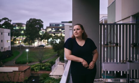 Jessica Preston, 19, who lives in Canberra and has been studying early childhood education, is standing on her balcony resting her arm on a rail