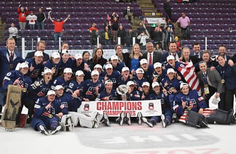 Team USA pose with the trophy.