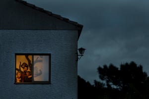 Santi BurgosSanti Burgos portrays his neighbours through their windows during the confinement in the Madrid town of Manzanares el Real. 