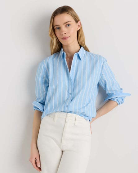 woman wearing blue striped shirt with white pants