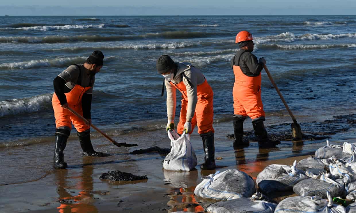 Volunteers clean a beach