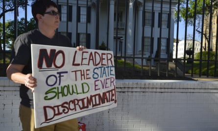 A protester at a rally outside governor Bryant’s mansion on 4 April, the day before the bill was passed.