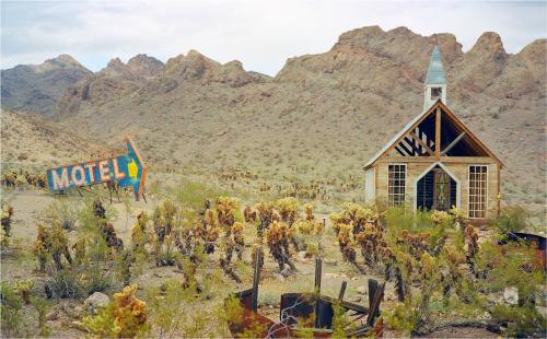 Mini Prayer for Motel, Nelson, Nevada I paid a taxi driver in Las Vegas $500 to drive me to his favourite ghost town. The place was 2 hours from The Strip. We arrived in Nelson, an old silver mining town that despite billing itself as truly deserted was in reality anything but. It was actually a sort of museum for ghost town tropes that Hollywood had imaged.