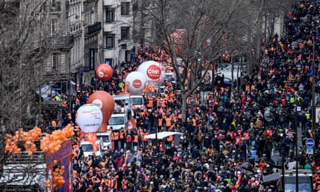 People take part in a demonstration in Paris as part of a nationwide day of strikes and protests called by unions over a proposed pensions overhaul.