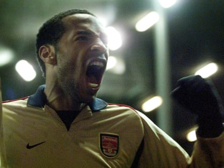 Thierry Henry celebrates scoring the penalty