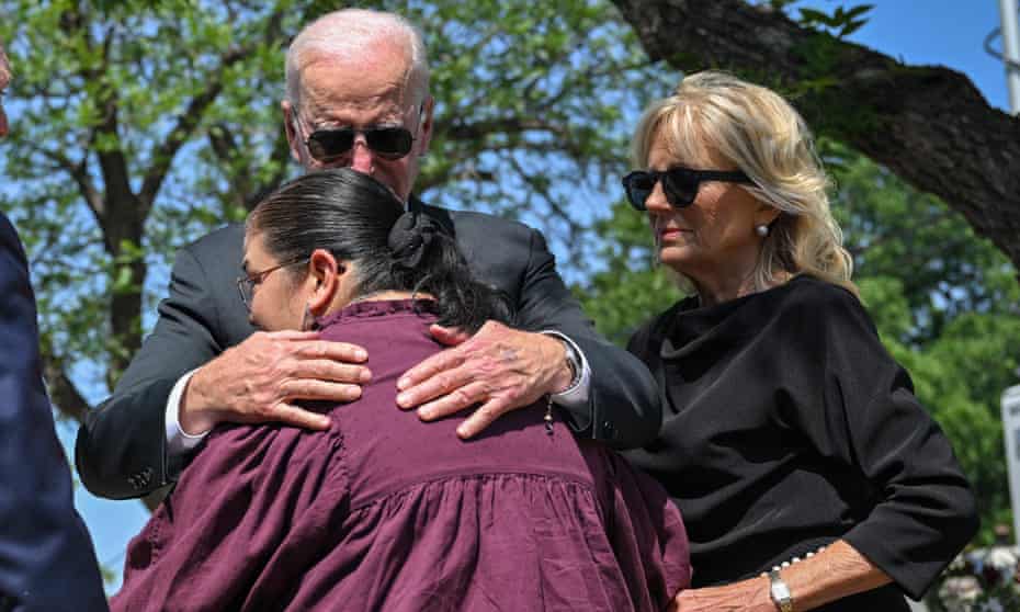 Joe Biden embraces Mandy Gutierrez, the principal of Robb elementary school in Uvalde, where 19 children and two adults were killed in May.
