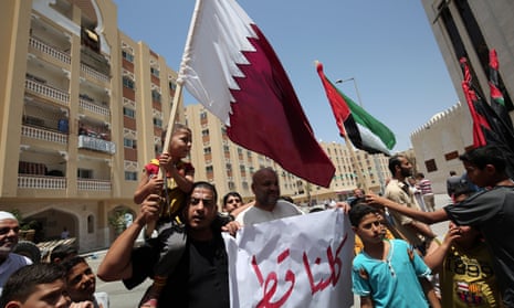 Residents of Qatari-funded housing complex hold a banner reading ‘We are all Qatar’ during a protest in Gaza last week in support of the blockaded Arab state