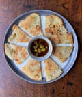 ‘a full 25 layers of scallion-packed, pastry delight.’