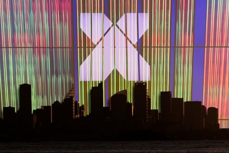 An ASX stock exchange screen behind Sydney at sunset, New South Wales, Australia, Australasia