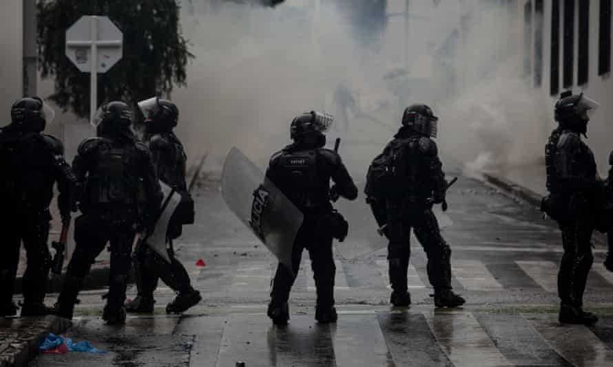 Riot police officers in the streets during demonstrations in Bogotá, Colombia, on 1 May.